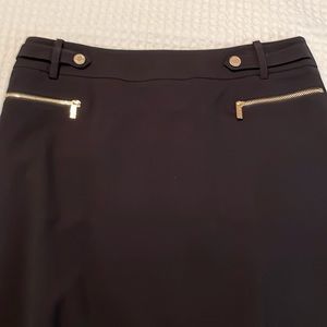 Calvin Klein skirt.  Black.  Back vent. Gold buttons & zippers